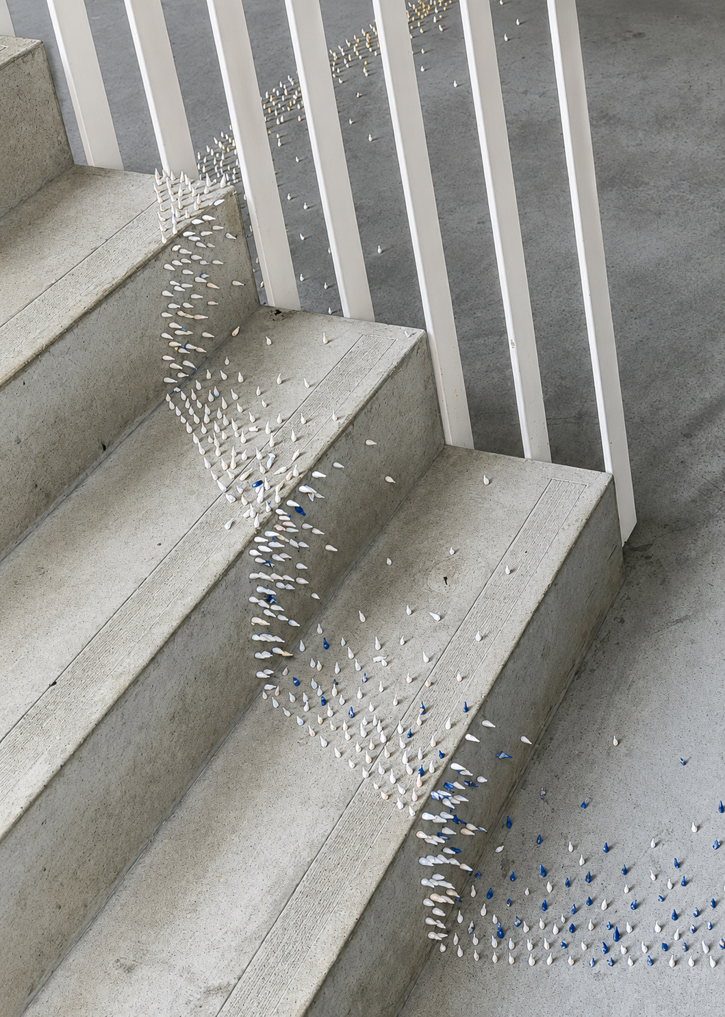 Ceramic elements spreading across architectural steps