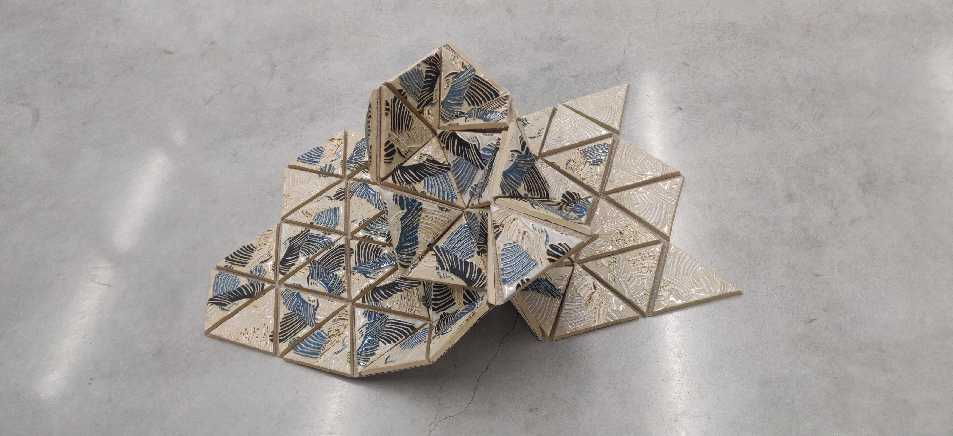 Murmuration, modular glazed ceramic triangular tiles