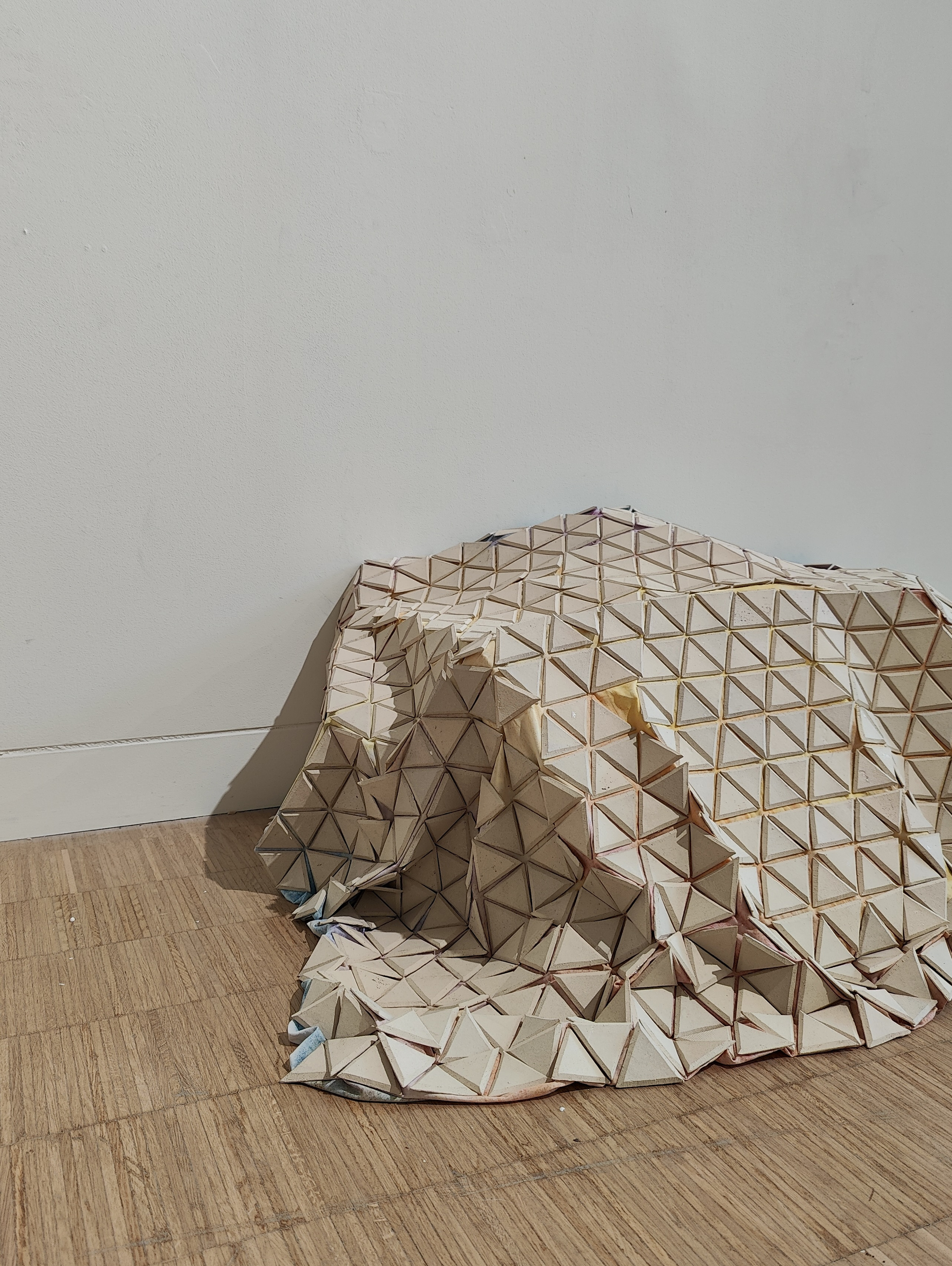 Detail of ceramic triangles on textile